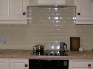Tiled wall behind hob and convection oven
